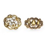TWO VICTORIAN BROOCHES comprising an openwork example formed by twisted sections of metal,