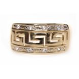 GENTLEMAN'S NINE CARAT GOLD GEM SET RING with central Greek key motif section of openwork design,