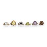 SIX GOLD GEM SET RINGS including an amethyst single stone ring and a peridot single stone ring,