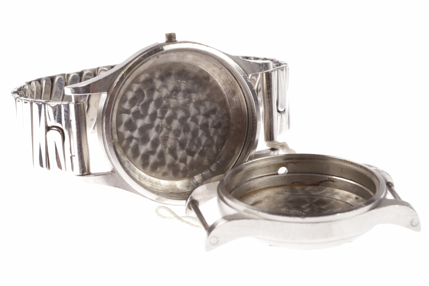 TWO MILITARY ISSUE STAINLESS STEEL WATCH CASES