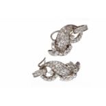 PAIR OF ART DECO PLATINUM DIAMOND SET EARRINGS each with a diamond set wave section overlapped by a