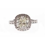 CERTIFICATED PLATINUM DIAMOND SOLITAIRE RING set with a cushion cut diamond of 3.