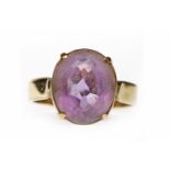 NINE CARAT GOLD AMETHYST DRESS RING set with a single oval amethyst 12.6mm long, size N-O, 3.