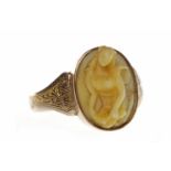 EARLY TWENTIETH CENTURY NINE CARAT GOLD IVORY SET RING set with an oval section of ivory carved to