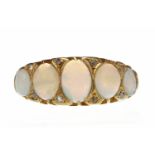 VICTORIAN EIGHTEEN CARAT GOLD OPAL AND DIAMOND RING the boat shaped bezel set with graduated oval