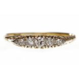 VICTORIAN STYLE EIGHTEEN CARAT GOLD DIAMOND FIVE STONE RING the elliptical bezel set with graduated