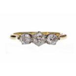 EIGHTEEN CARAT GOLD DIAMOND THREE STONE RING set with round brilliant cut diamonds totalling