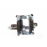 ART DECO STYLE AQUAMARINE AND DIAMOND DRESS RING set with a single emerald cut aquamarine 12.7x5.