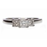 EIGHTEEN CARAT WHITE GOLD DIAMOND THREE STONE RING set with princess cut diamonds totalling