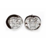 PAIR OF EIGHTEEN CARAT WHITE GOLD DIAMOND STUD EARRINGS each set with a round brilliant cut diamond