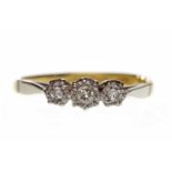 EIGHTEEN CARAT GOLD DIAMOND THREE STONE RING with three illusion set diamonds totalling