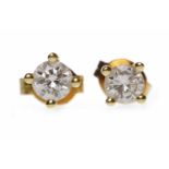 PAIR OF EIGHTEEN CARAT GOLD DIAMOND STUD EARRINGS each set with a round brilliant cut diamond of