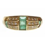 EIGHTEEN CARAT GOLD EMERALD AND DIAMOND SET BAND of tapered form,