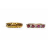 NINE CARAT GOLD RUBY RING set with round rubies interspaced by pairs of round diamonds, size N, 3.