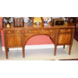 A WILLIAM IV PERIOD MAHOGANY SIDEBOARD, probably Irish, with three quarter back and plate rack above