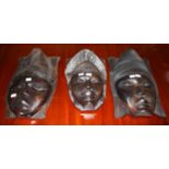 THREE SIMILAR CARVED HARDWOOD TRIBAL MASKS, 15.5'' (39cm) approx. (3)