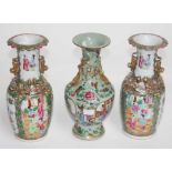 A PAIR OF CHINESE FAMILLE ROSE VASES, each with two temple lion handles, and four dragons in relief,