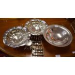 A PAIR OF LOBED AND SILVER PLATED BOWLS EACH ON FOUR LEGS, 9'' (23 cm); together with another