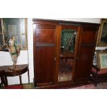 A THREE-DOOR MAHOGANY WARDROBE, 20th century with centre mirror panel, raised on bracket feet,