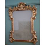 A GILTWOOD WALL MIRROR