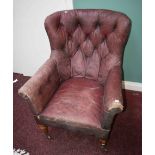 AN EARLY VICTORIAN BUTTON-BACK LIBRARY ARMCHAIR