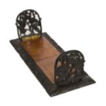 A GOOD 19TH CENTURY IRISH CARVED BOG OAK BOOK STAND