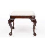 A RECTANGULAR CHIPPENDALE STYLE MAHOGANY STOOL