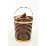 A MAHOGANY AND BRASS BOUND RIBBED PEAT BUCKET