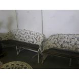 A PAIR OF VERY HEAVY RUSTIC CAST IRON GARDEN BENCHES