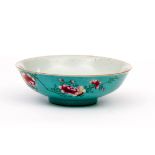 AN UNUSUAL CHINESE TURQUOISE GROUND FAMILLE ROSE BOWL