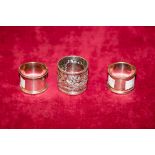 A SET OF SIX SILVER PLATED NAPKIN RINGS