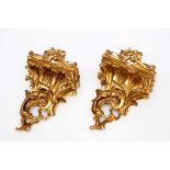 A PAIR OF ROCOCO STYLE GILTWOOD WALL BRACKETS