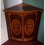 A GEORGE III STYLE BOW-FRONTED CORNER CABINET