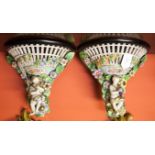 A PAIR OF GERMAN PORCELAIN FLOWER-ENCRUSTED WALL BRACKETS