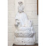 A CARVED AND WHITE PAINTED WOODEN FIGURE OF A BUDDHA