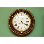 A CIRCULAR GRAINED-WOOD AND PANEL-GILT WALL CLOCK