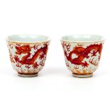 A RARE PAIR OF IRON RED "DRAGON" WINE CUPS