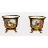 A PAIR OF ATTRACTIVE FRENCH SEVRES STYLE COBALT GROUND PORCELAIN AND BRASS MOUNTED JARDINIERES