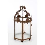 AN EMBOSSED BRASS AND METAL HALL LANTERN