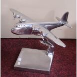 A POLISHED ALUMINIUM MODEL OF A FOUR-ENGINE PROPELLER AEROPLANE