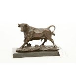 A SMALL BRONZE FIGURE OF A PRANCING BULL