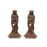 A PAIR OF CAST IRON DOOR STOPS