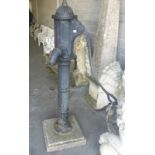 A LARGE HEAVY OLD CAST IRON STREET OR YARD PUMP