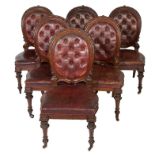 A RARE SET OF FOURTEEN CARVED VICTORIAN MAHOGANY DINING CHAIRS