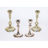 A PAIR OF OVAL SILVER PLATED CANDLESTICKS