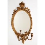 A 19TH CENTURY OVAL GILT AND GESSO GIRANDOLE