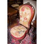 A VICTORIAN WALNUT AND TAPESTRY COVERED OCCASIONAL OR NURSING CHAIR