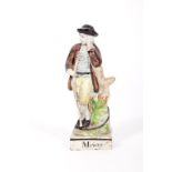 A RARE EARLY 19TH CENTURY STAFFORDSHIRE PEARLWARE FIGURE