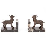 A PAIR OF BRONZE AND MARBLE BOOKENDS