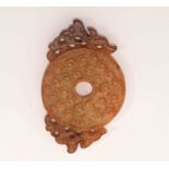 A CHINESE PIERCED LIGHT JADE BI-DISC